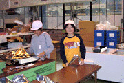 Children learning by hands-on factory work